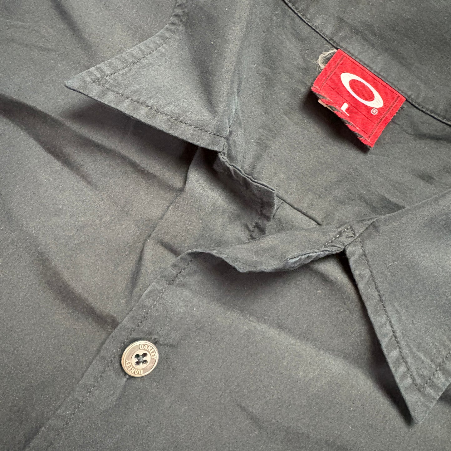 Vintage Oakley Black Metal O Short Sleeve Shirt - L